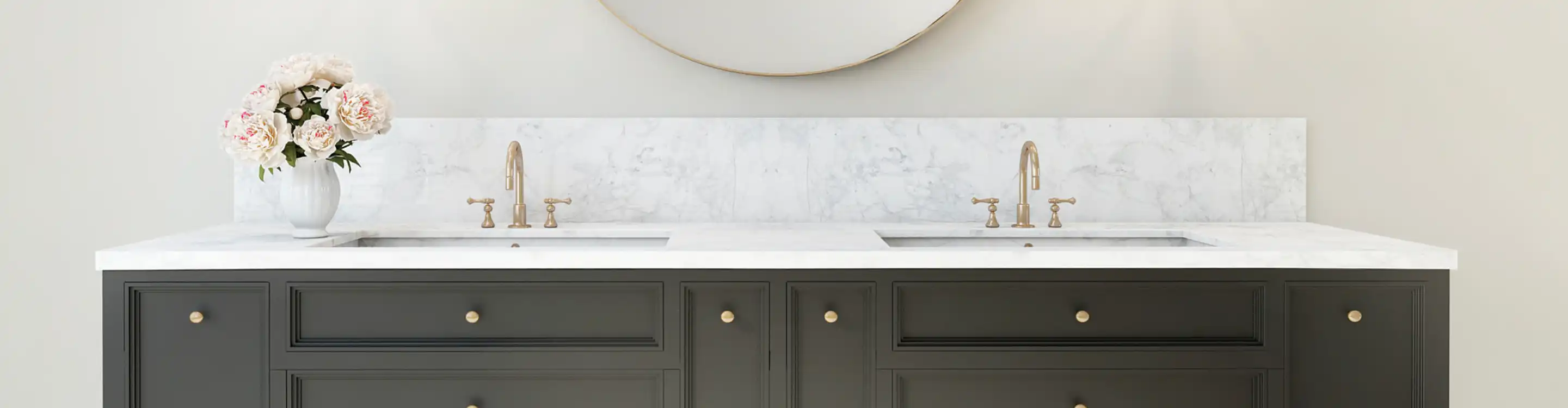 Bathroom White Marble Countertop with Sink and Gold Hardware.